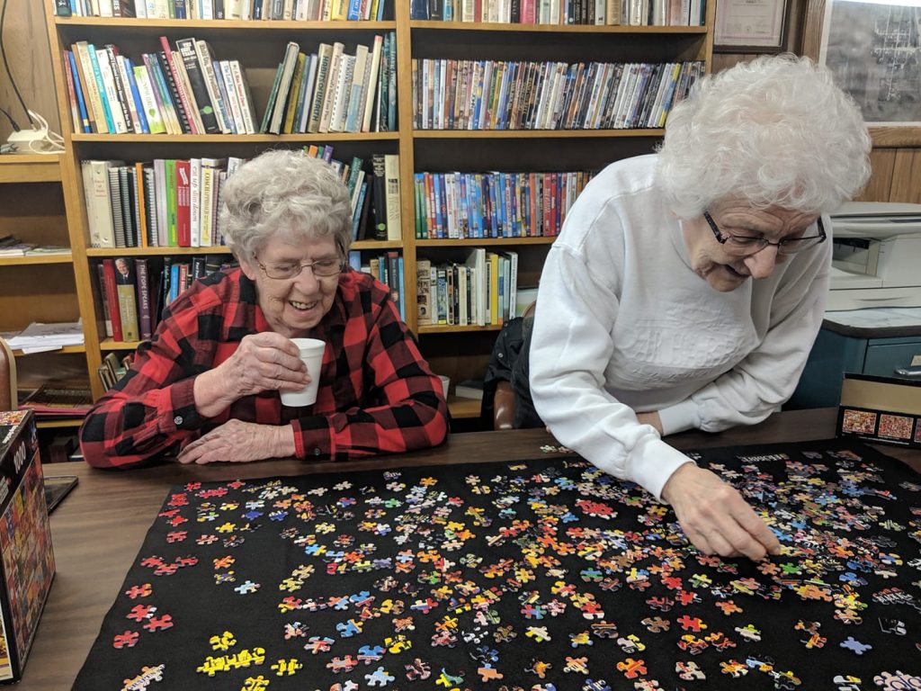 Women working on puzzle at Varina Library